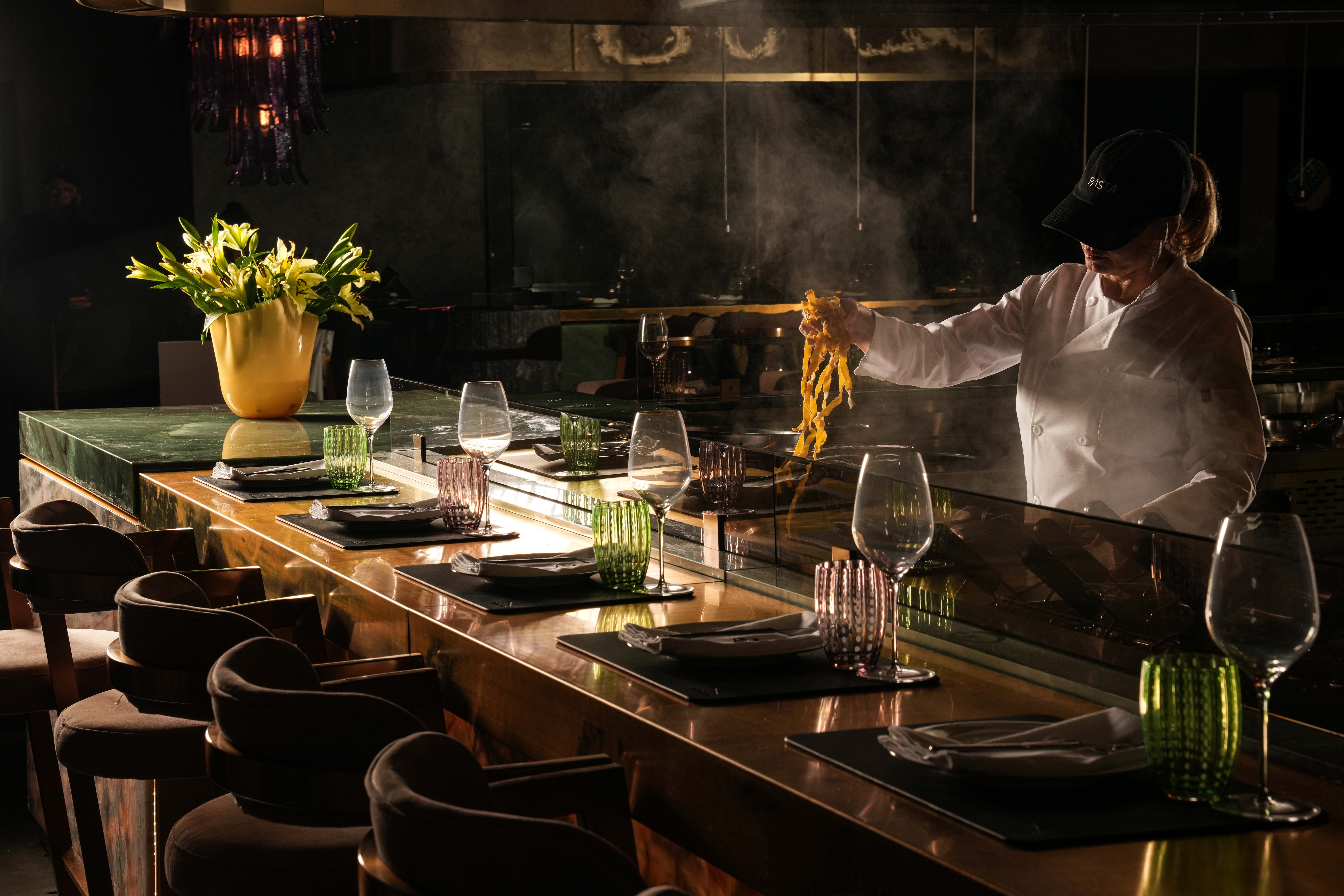 A Pasta Bar chef-counter/open kitchen promotional photograph.