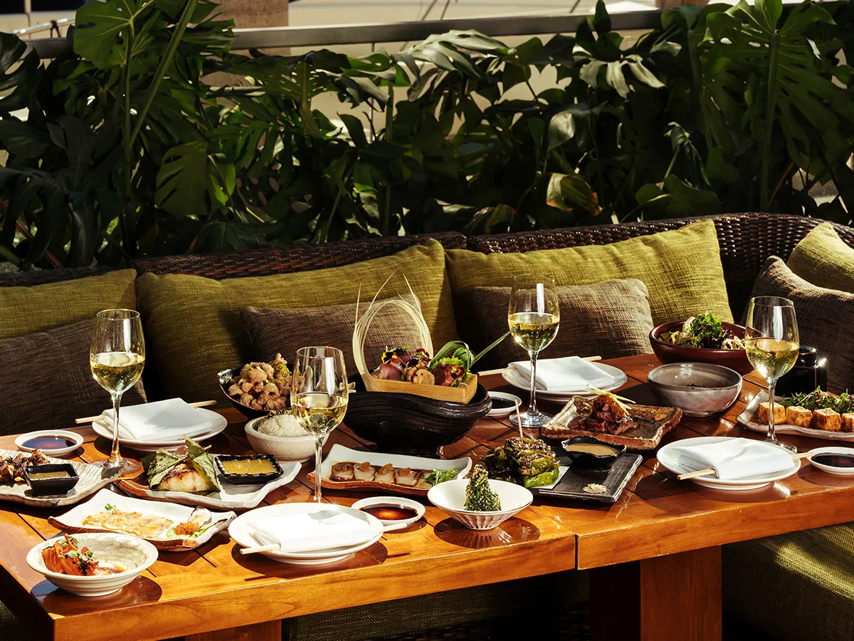 An outdoor dining table at Zuma Miami, shown in its official tourism listing. Venue context; pictured spread is not promised as the current Miami Spice menu.