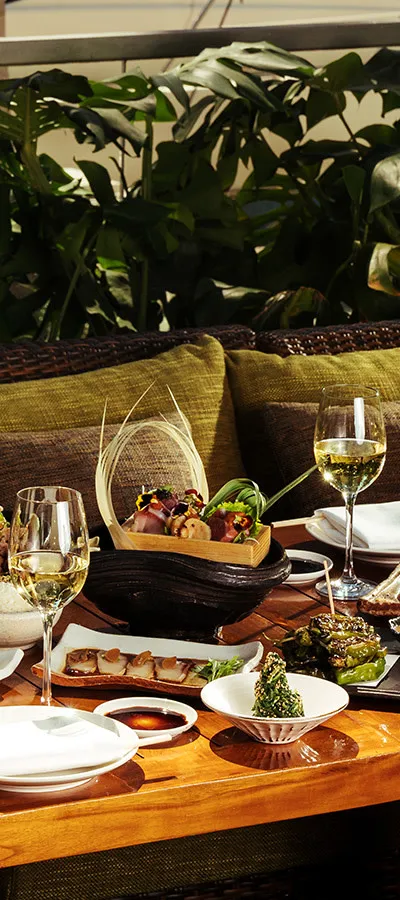 An outdoor dining table at Zuma Miami, shown in its official tourism listing. Venue context; pictured spread is not promised as the current Miami Spice menu.
